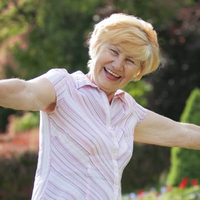 Smiling senior woman enjoying the outdoors