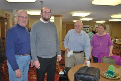 Residents and staff interacting in a common area
