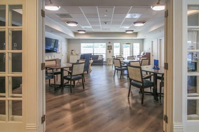 Bright common area with tables and chairs