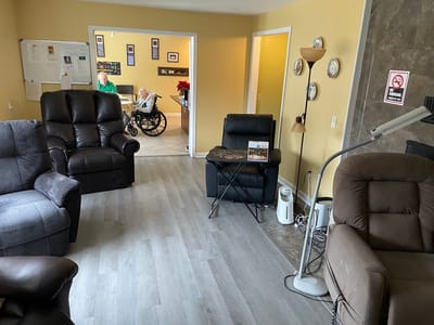 Common area with residents and seating.