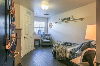 Cozy resident room with nautical decor and warm lighting
