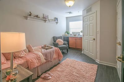 Cozy resident room with soft decor and natural light