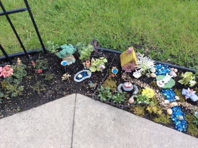 A colorful garden area with decorative elements