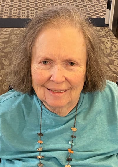 Resident smiling in a common area