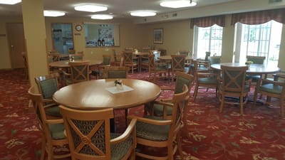 Bright dining area with tables and chairs