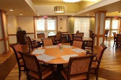 Interior view of a dining area with tables and chairs