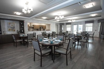 Empty dining room setup with tables and chairs