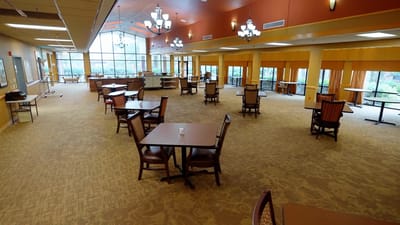 Interior view of a common area with tables and chairs