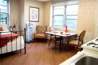 Cozy interior of a resident's room with dining area