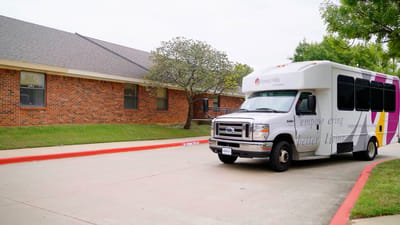 Facility transport vehicle in front of the building