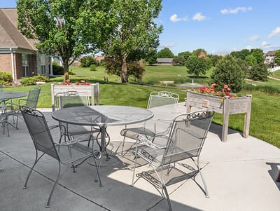 Outdoor patio area with tables and chairs