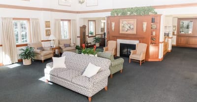 Common area with seating and a fireplace