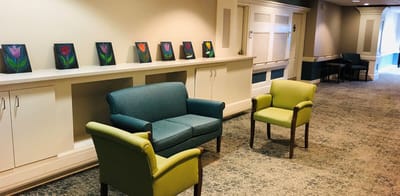 Interior seating area with floral artwork