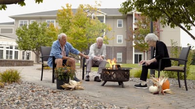 Residents enjoying a fire pit in an outdoor space