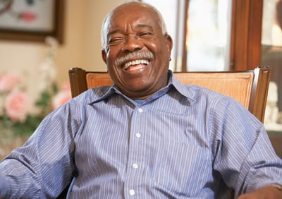 Smiling resident enjoying a moment in a common area