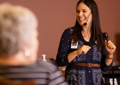Staff member leading an activity for residents