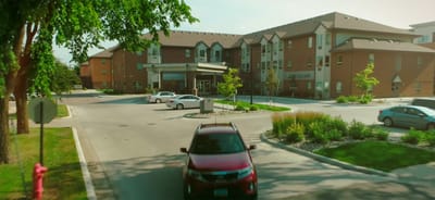 Exterior view of Eventide Fargo with parking area