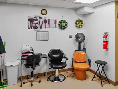 Interior view of a salon area with styling chairs