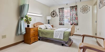 Cozy resident room with bed and decor