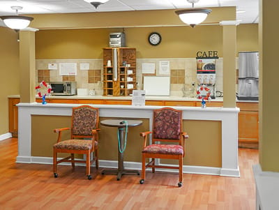Cafe area with seating and kitchen appliances