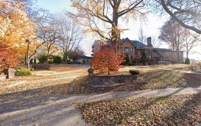 Exterior view of Francesca Residence surrounded by autumn leaves