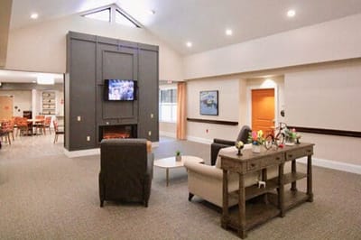 Bright common area with seating and TV