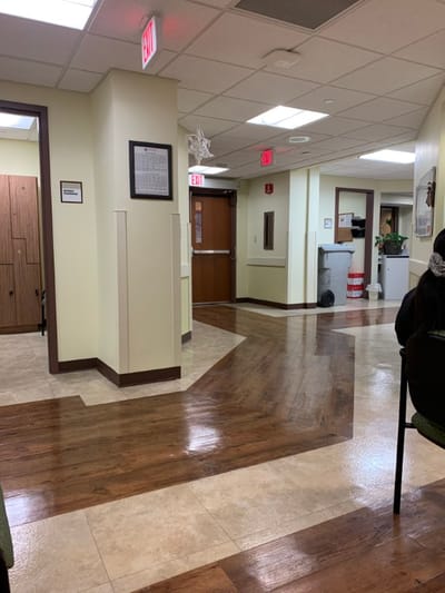 Interior hallway of a care facility with seating