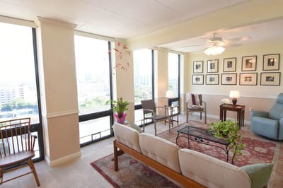 Bright interior common area with seating and windows