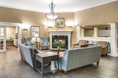 Interior common area with seating and a fireplace