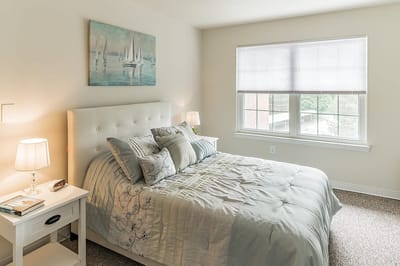 Cozy resident bedroom with a view and light decor