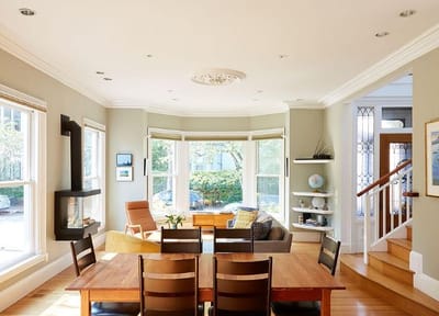 Bright, inviting common area with dining table and seating