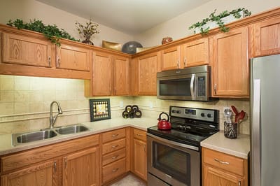 Modern kitchen with wooden cabinets and appliances