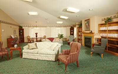 Cozy common area with seating and bookshelves