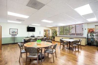 Bright common area with tables and chairs