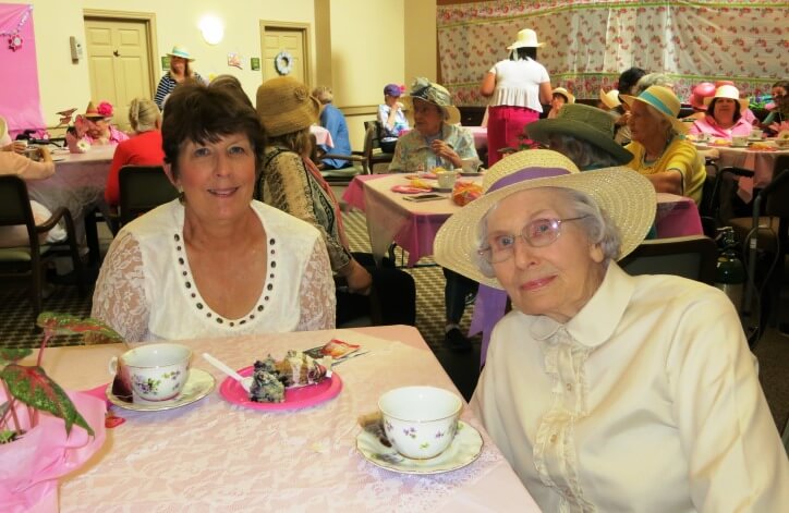 Residents enjoying tea party with smiles