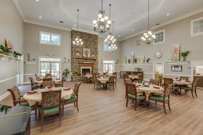 Bright dining room with elegant decor and tables set for meals