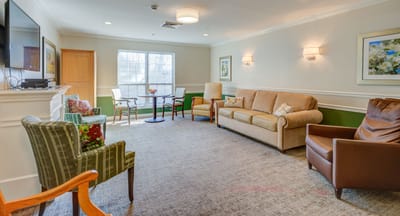 Bright common area with seating and natural light