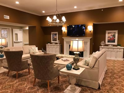 A cozy common area with comfortable seating and decor