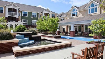 Scenic view of a courtyard with water feature and seating