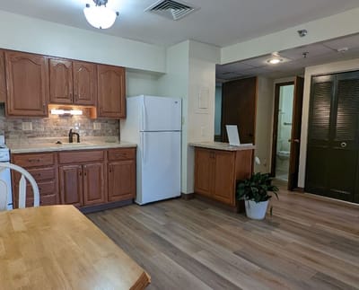 Interior view of a cozy kitchen area in a resident's room