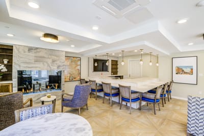 Modern common area with seating and fireplace