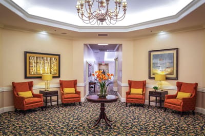 Cozy common area with seating and floral decor