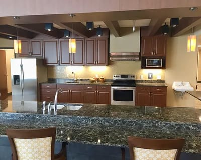 Bright kitchen area with modern appliances and granite countertops