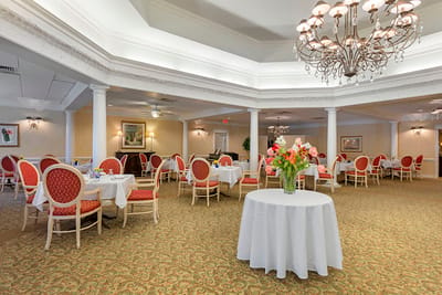 Elegant dining room with flowers and chandelier
