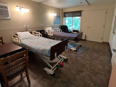 Private resident room with beds and furniture