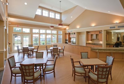 Bright common area with tables and chairs