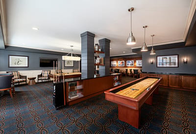 Bright common area with shuffleboard and seating