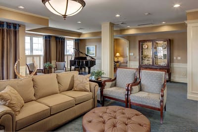 Comfortable common area with seating and piano
