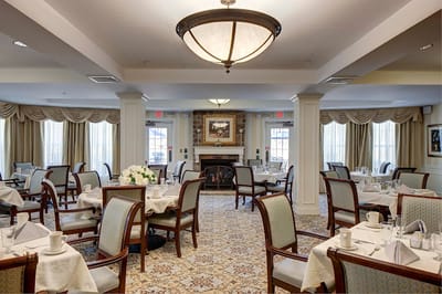 Elegant dining room setup with tables and chairs