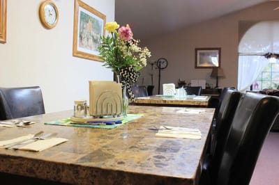 Dining area set up with a decorative table arrangement